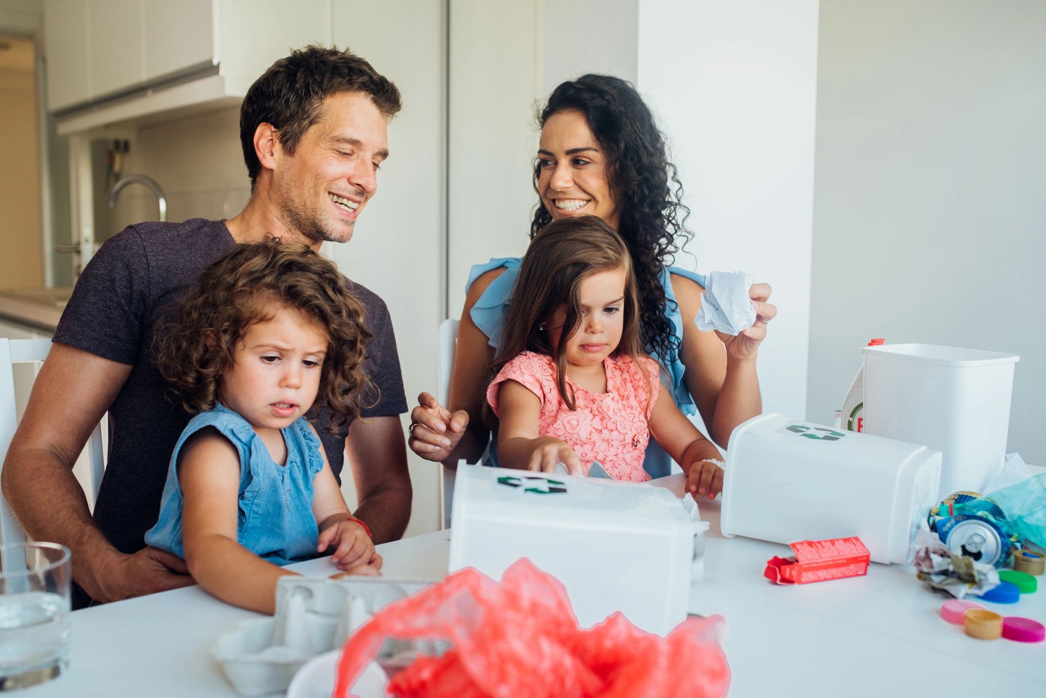 smiling parents and children with handmade gifts