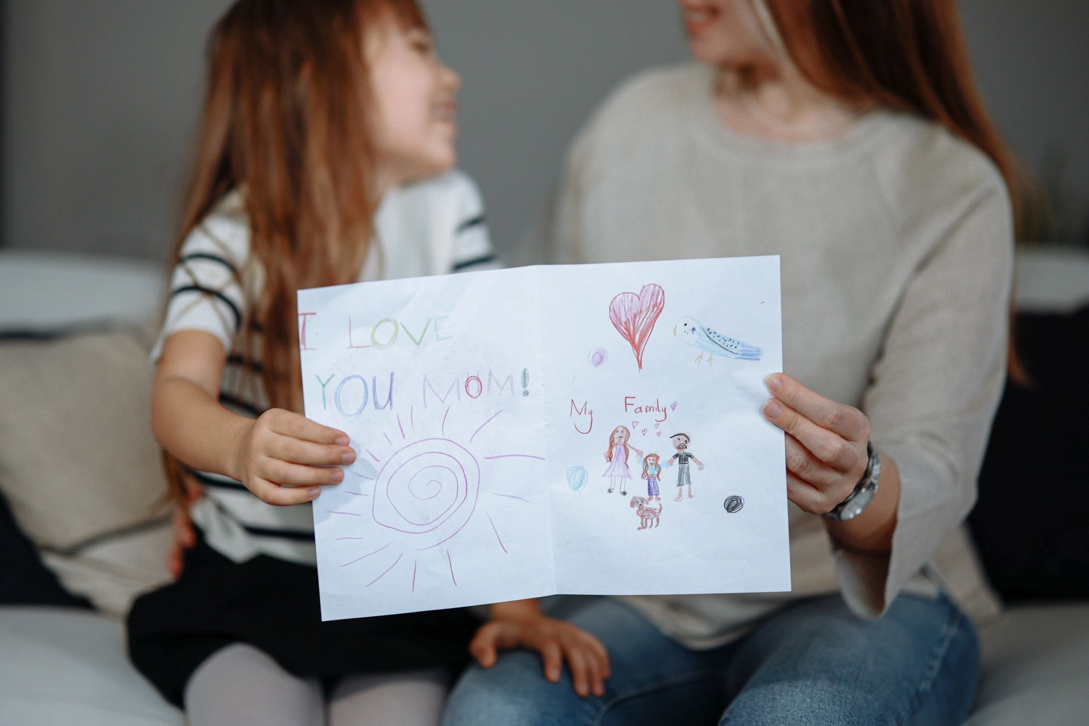 smiling parents and children with handmade gifts
