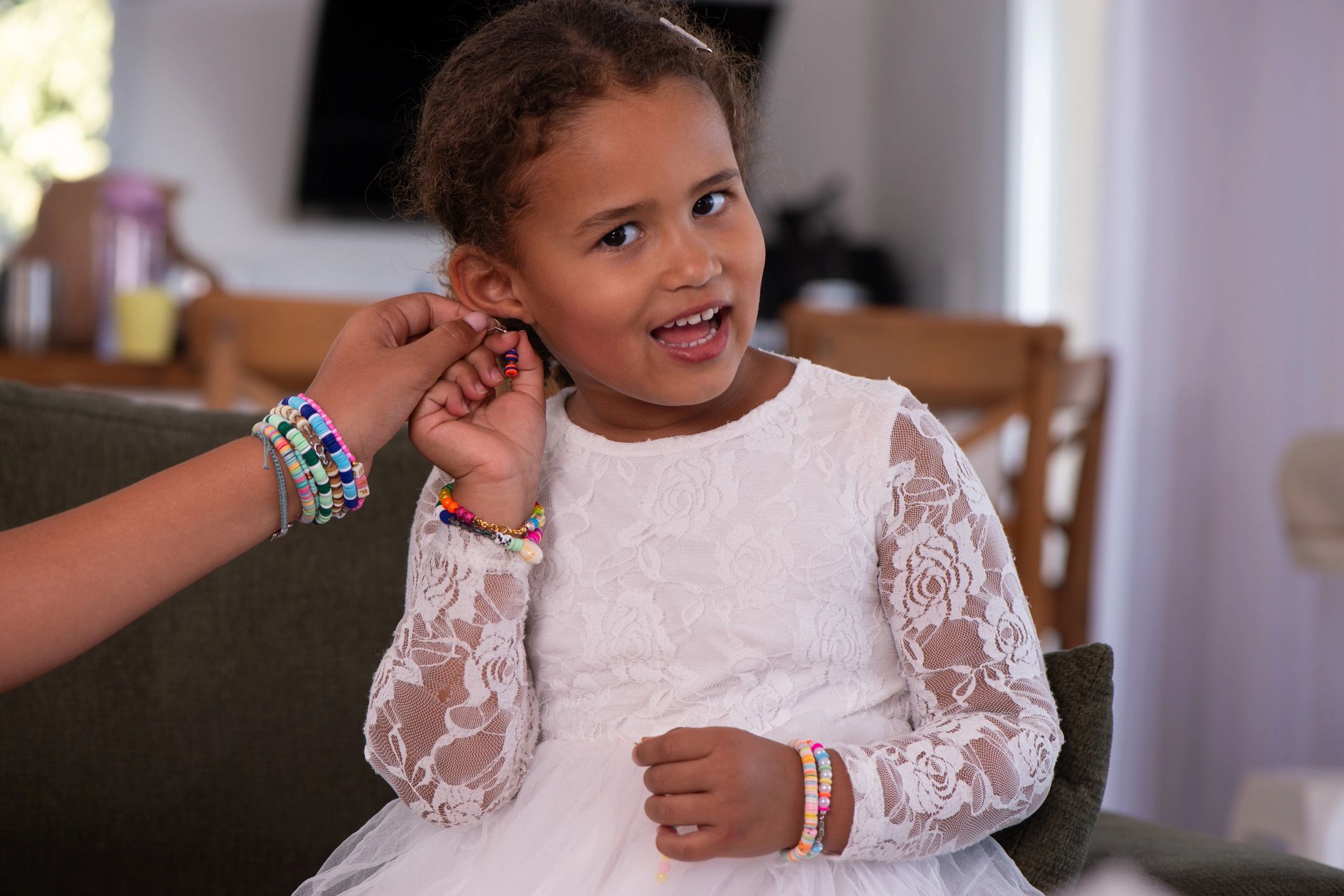 children making beaded bracelets jewelry playful